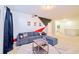 Home theater room features a comfortable gray sofa and projector on the wall at 2555 Shanti Dr, Kissimmee, FL 34746