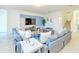 Spacious living room featuring tile floors, comfortable sofas, and stylish decor at 2555 Shanti Dr, Kissimmee, FL 34746