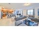 Open-concept living area with a sofa, adjacent to the kitchen and dining area at 2555 Shanti Dr, Kissimmee, FL 34746