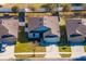 Aerial view of a well-kept home with a fenced backyard, nestled in a tidy residential neighborhood at 2665 Rotherham Rd, Tavares, FL 32778