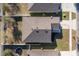 Aerial view of a well maintained roof and manicured landscaping, located on a residential street at 2665 Rotherham Rd, Tavares, FL 32778