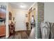 Inviting foyer featuring stylish flooring, an arched doorway with stone-look accents, and neutral wall colors at 2665 Rotherham Rd, Tavares, FL 32778