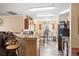 An eat-in kitchen featuring a breakfast bar and a dining table in an open concept at 2665 Rotherham Rd, Tavares, FL 32778