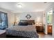 A well-organized main bedroom with dark wood furniture, stylish décor, and ambient lighting, offers a serene retreat at 2665 Rotherham Rd, Tavares, FL 32778