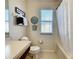 This bathroom has neutral-colored walls, a toilet, and a tub/shower combo at 2706 Bushman Dr, Kissimmee, FL 34746