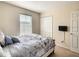 Neutral bedroom with a double bed, built in wardrobe, carpet flooring and window at 2706 Bushman Dr, Kissimmee, FL 34746