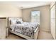 This bedroom has a beautifully decorated bed, a window, and a closet at 2706 Bushman Dr, Kissimmee, FL 34746