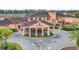 Impressive clubhouse featuring a grand entrance and well-manicured landscaping in a vibrant community at 2706 Bushman Dr, Kissimmee, FL 34746