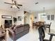 Cozy living and dining area with comfortable seating and a staircase leading to the upper level at 2706 Bushman Dr, Kissimmee, FL 34746
