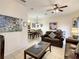 This living room features neutral colors, nice art, and a dining space at 2706 Bushman Dr, Kissimmee, FL 34746