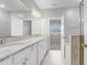 Bathroom with double sinks, granite countertop and vanity, tiled floors and backsplash at 2725 Econ Landing Blvd, Orlando, FL 32825