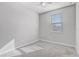 Neutral bedroom with carpeted floors, ceiling fan and a window with blinds at 2725 Econ Landing Blvd, Orlando, FL 32825