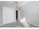 Neutral bedroom with carpet, closet, ceiling fan, and doorway to another room at 2725 Econ Landing Blvd, Orlando, FL 32825