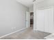Bright, carpeted bedroom with large closet and neutral color palette at 2725 Econ Landing Blvd, Orlando, FL 32825