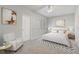 Neutral bedroom featuring a plush bed, modern decor, and soft natural light from the window at 2725 Econ Landing Blvd, Orlando, FL 32825