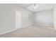 Neutral bedroom with carpet, ceiling fan, window, and doorway at 2725 Econ Landing Blvd, Orlando, FL 32825