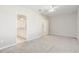 Spacious carpeted bedroom with ensuite bathroom; neutral paint throughout at 2725 Econ Landing Blvd, Orlando, FL 32825