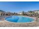 Large community pool surrounded by lounge chairs and lush landscaping, perfect for relaxation at 2725 Econ Landing Blvd, Orlando, FL 32825