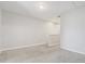 Neutral hallway with carpeted floors and access to other rooms in the house at 2725 Econ Landing Blvd, Orlando, FL 32825
