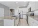 Beautiful kitchen with granite countertops, stainless steel appliances and white cabinetry, ideal for cooking at 2725 Econ Landing Blvd, Orlando, FL 32825