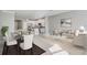 Open concept living space with a modern kitchen, dining area, and comfortable living room at 2725 Econ Landing Blvd, Orlando, FL 32825