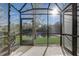 Screened patio overlooking a pond, offering serene outdoor space at 2725 Econ Landing Blvd, Orlando, FL 32825