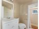Cozy bathroom features tiled shower, white vanity with sink and a mirror at 27630 Jean Ave, Paisley, FL 32767