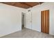 Neutral bedroom featuring light wood-look floors and two closets at 27630 Jean Ave, Paisley, FL 32767