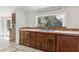 Classic kitchen with wood cabinets, stainless steel sink, and a large window overlooking the backyard at 27630 Jean Ave, Paisley, FL 32767