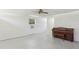 Neutral living area offers a ceiling fan, piano and access to other rooms at 27630 Jean Ave, Paisley, FL 32767