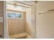 Tiled shower features built in bench, decorative mosaic border, and bright lighting at 27630 Jean Ave, Paisley, FL 32767