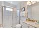 Bathroom with a glass-enclosed shower, modern fixtures, and marble tiling for a clean, spa-like feel at 280 Burma St, Kissimmee, FL 34747