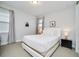 Bright bedroom with a contemporary bed, sleek nightstands, and soft drapes for a relaxing ambiance at 280 Burma St, Kissimmee, FL 34747