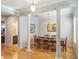 Elegant dining room featuring hardwood floors, decorative pillars, and traditional chandelier at 2979 Upper Park Rd, Orlando, FL 32814