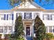 Charming traditional home with a symmetrical facade, navy shutters, and well-manicured landscaping at 2979 Upper Park Rd, Orlando, FL 32814