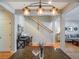 Bright foyer with a desk, hardwood floors, and a staircase leading to the upper level at 2979 Upper Park Rd, Orlando, FL 32814