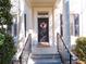 Front porch with decorative floral wreath on the front door and classic architectural details at 2979 Upper Park Rd, Orlando, FL 32814