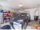 Spacious garage with a parked SUV, storage shelves, and a rolling garage door at 2979 Upper Park Rd, Orlando, FL 32814