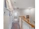 Upstairs hallway with carpet, leading to rooms with recessed lighting, and wall decor at 2979 Upper Park Rd, Orlando, FL 32814