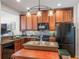 Well-appointed kitchen with granite countertops, stainless appliances, and rich wood cabinetry at 2979 Upper Park Rd, Orlando, FL 32814