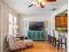 Comfortable living room with hardwood floors, ceiling fan, and a decorative entertainment center at 2979 Upper Park Rd, Orlando, FL 32814