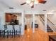 Open floor plan with eat in kitchen, bar seating, and hardwood floors at 2979 Upper Park Rd, Orlando, FL 32814