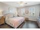 Comfortable main bedroom with wood floors, neutral walls, ceiling fan, and shuttered windows at 2979 Upper Park Rd, Orlando, FL 32814