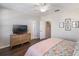 Spacious main bedroom with wood floors, a ceiling fan, and a wooden dresser at 2979 Upper Park Rd, Orlando, FL 32814