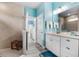 Well-lit bathroom includes double vanity with granite counters, a shower, and tiled flooring at 3114 Meleto Blvd, New Smyrna Beach, FL 32168