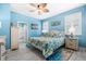 Inviting bedroom with ceiling fan, coastal decor, and shuttered windows creating a relaxing space at 3114 Meleto Blvd, New Smyrna Beach, FL 32168