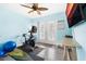 Bright exercise room featuring fitness equipment, mirrored walls, and a French door to the outside at 3114 Meleto Blvd, New Smyrna Beach, FL 32168