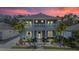 Beautiful two-story home with manicured landscaping, dual balconies, and a welcoming entrance at 3114 Meleto Blvd, New Smyrna Beach, FL 32168