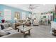 Open-concept living area with a blend of comfortable seating and a seamless flow to the kitchen at 3114 Meleto Blvd, New Smyrna Beach, FL 32168