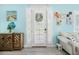 Bright living room with coastal decor, shuttered windows, and stylish furnishings at 3114 Meleto Blvd, New Smyrna Beach, FL 32168
